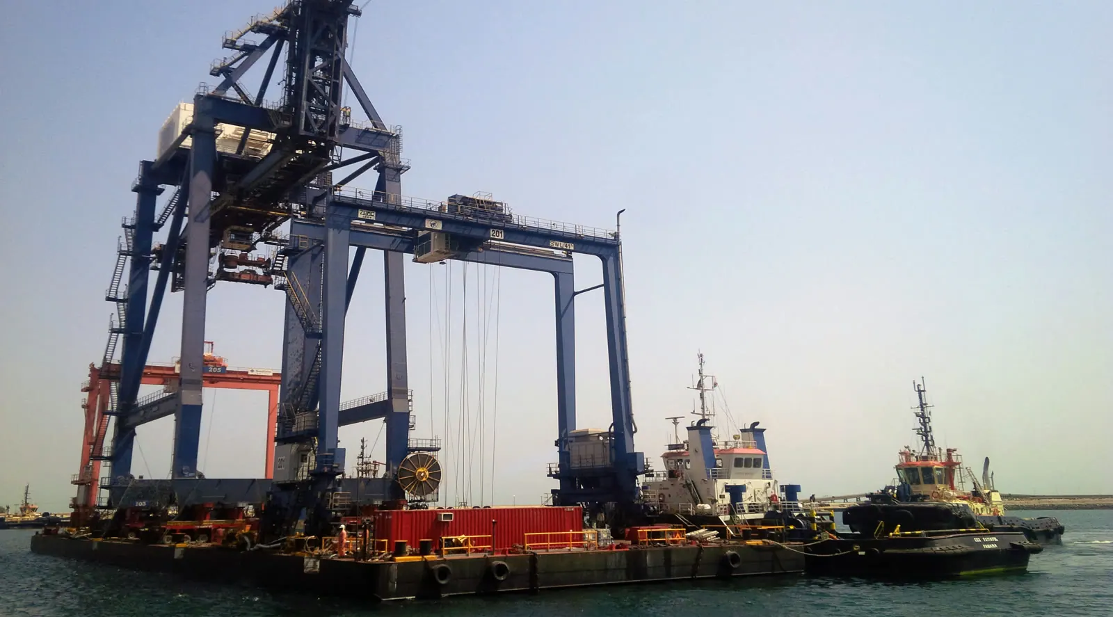 Gantry crane at a port with vessels alongside